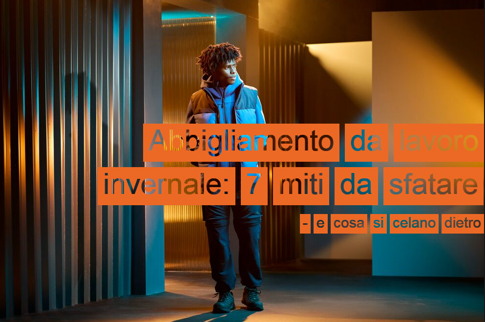 Un lavoratore con abbigliamento da lavoro blu e nero che si trova in uno spazio con diversi passaggi. Le pareti sono a righe e si notano giochi di luce e ombra. Sul lato destro dell&rsquo;immagine compare il titolo: Abbigliamento da lavoro invernale: 7 miti &ndash; e cosa c&rsquo;&egrave; davvero dietro